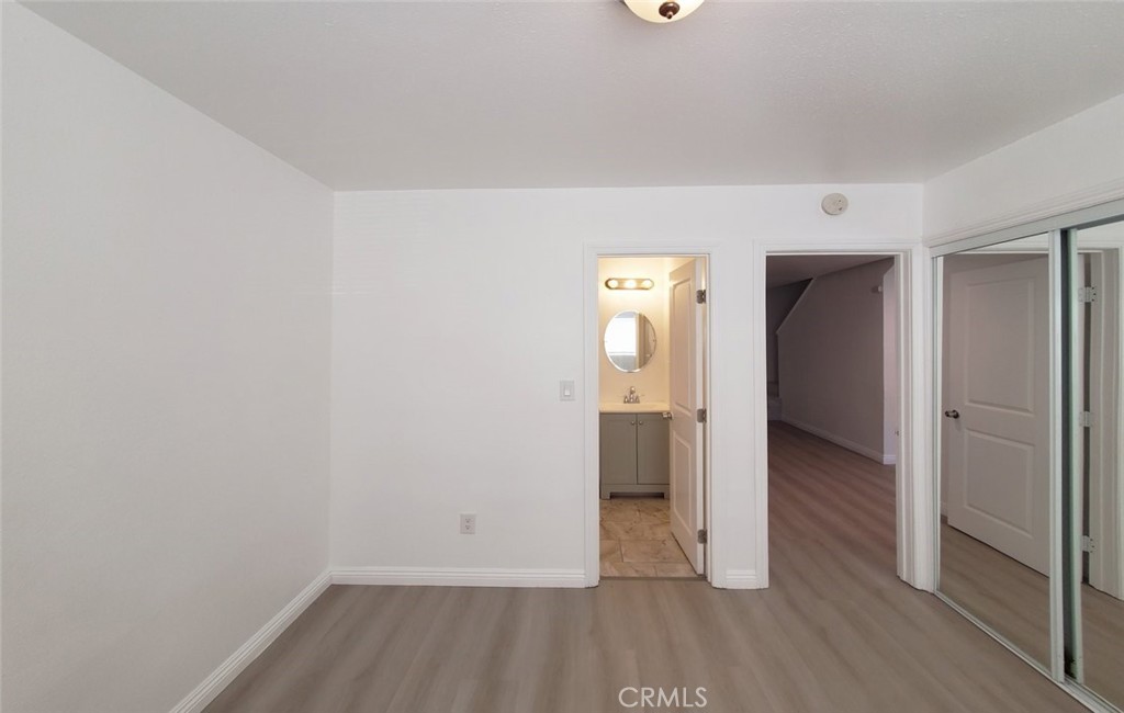 2020 West 23rd Street, Unit 17 Long Beach, CA 90810 - Photo 13 of 28 wooden floor in an empty room