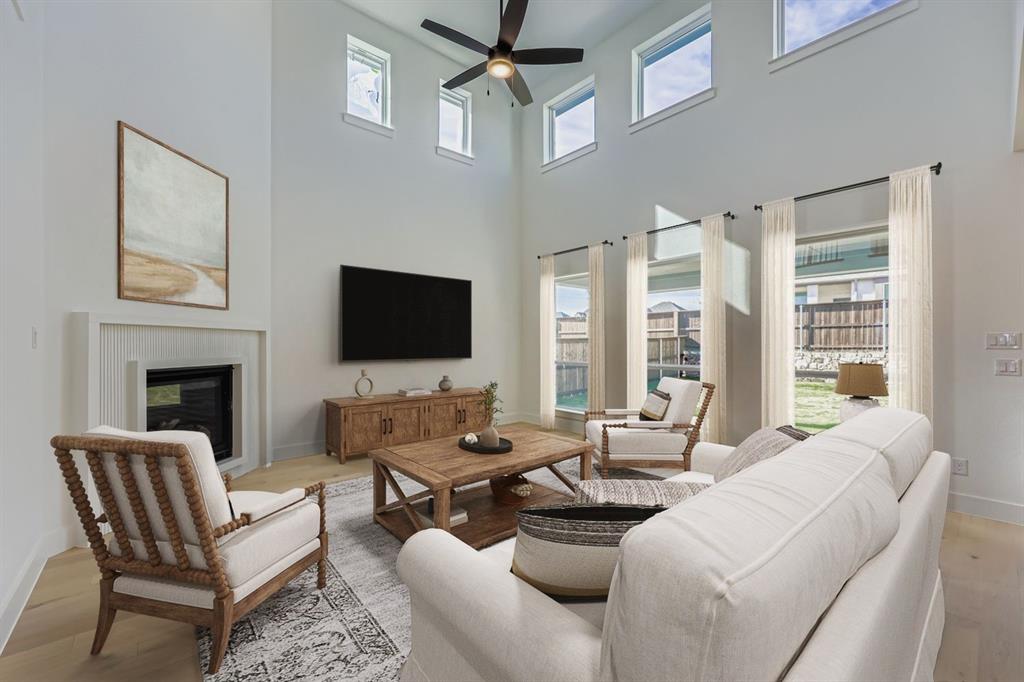 1841 Pk Vista Way Midlothian, TX 76065 - Photo 4 of 28 a living room with furniture a flat screen tv and a fireplace