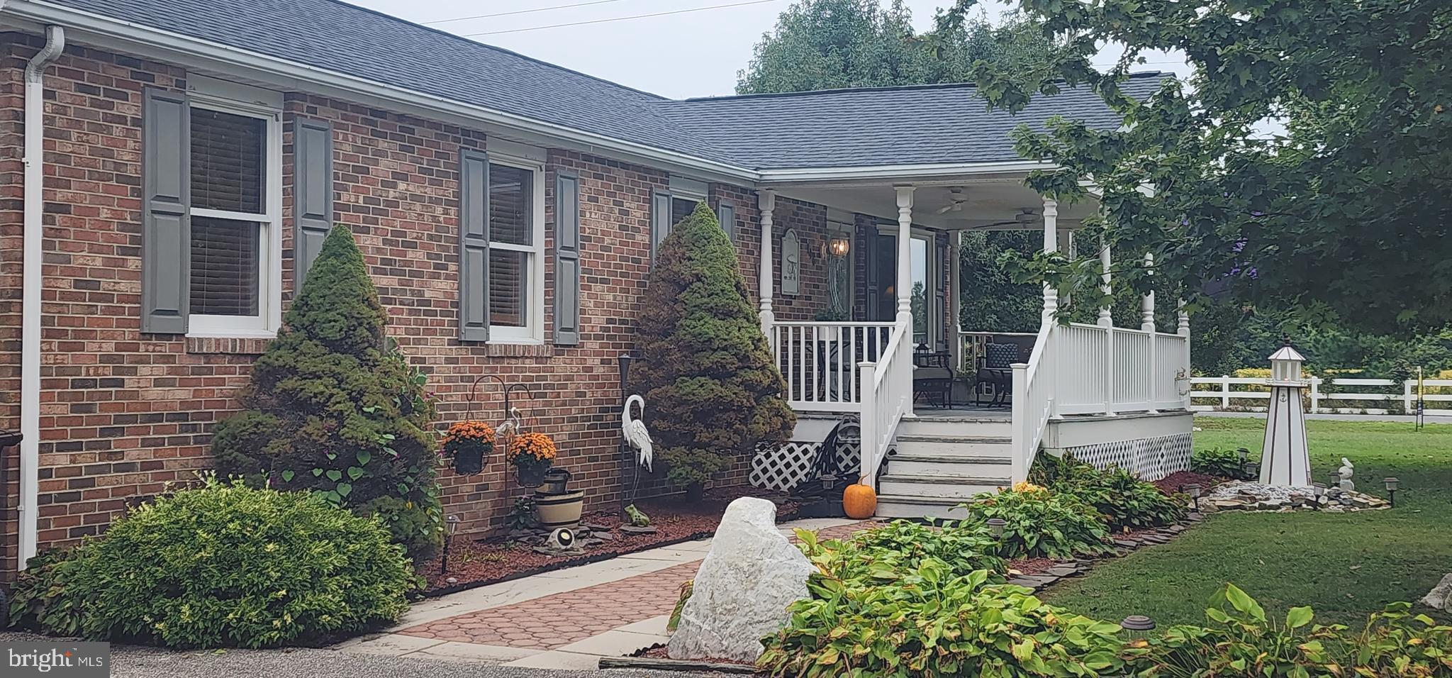 116 Kent Point Road Stevensville, MD 21666 - Photo 11 of 32 a front view of a house with a garden