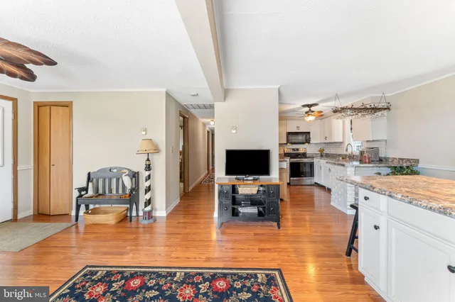 a hallway with dining table and chairs