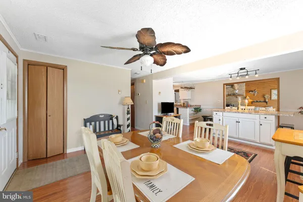 a view of a dining room with furniture and wooden floor