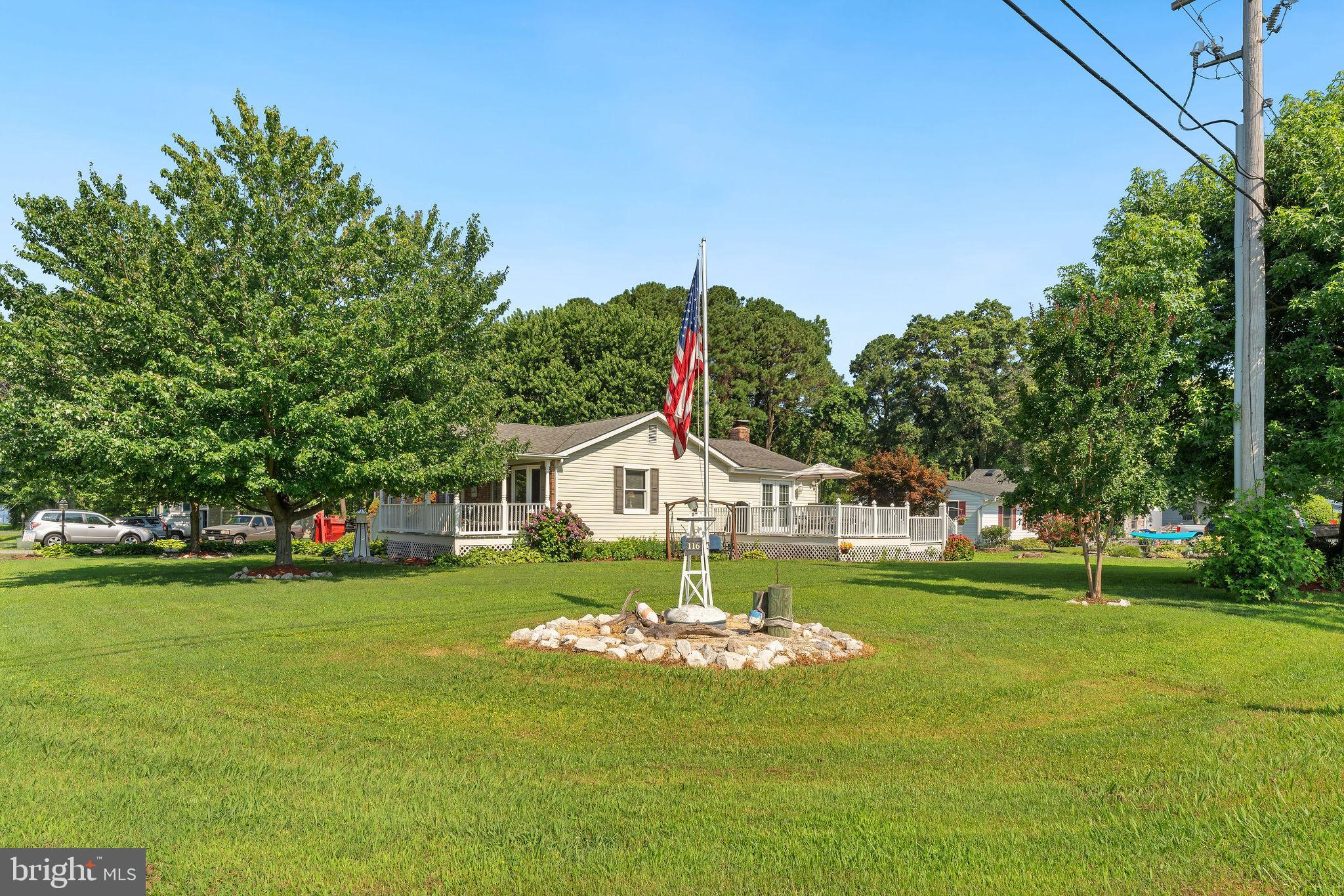 116 Kent Point Road Stevensville, MD 21666 - Photo 6 of 32 a view of a house with a big yard and potted plants