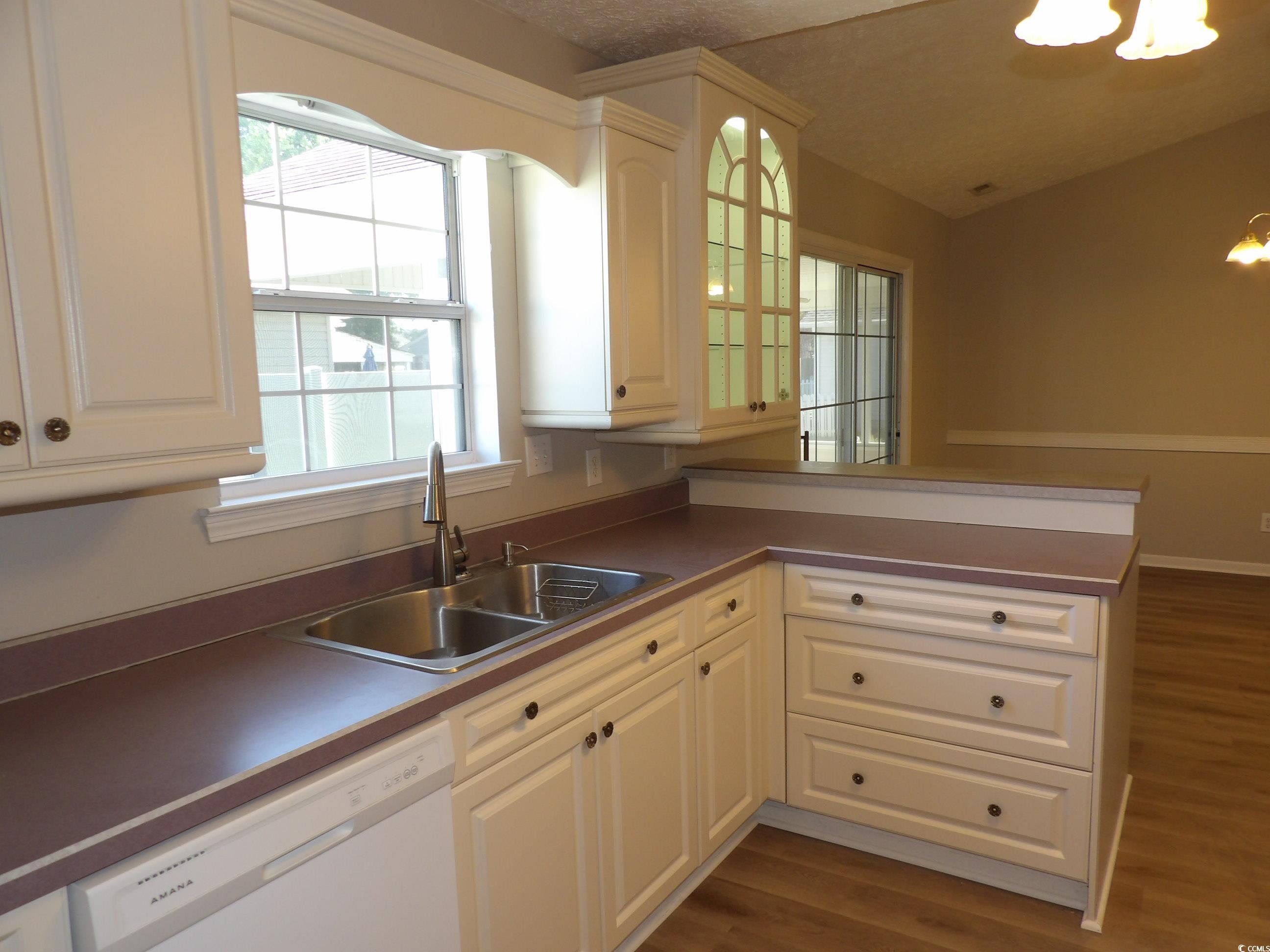 7971 Spruce Lane Murrells Inlet, SC 29576 - Photo 8 of 27 Kitchen featuring dishwasher, a textured ceiling,