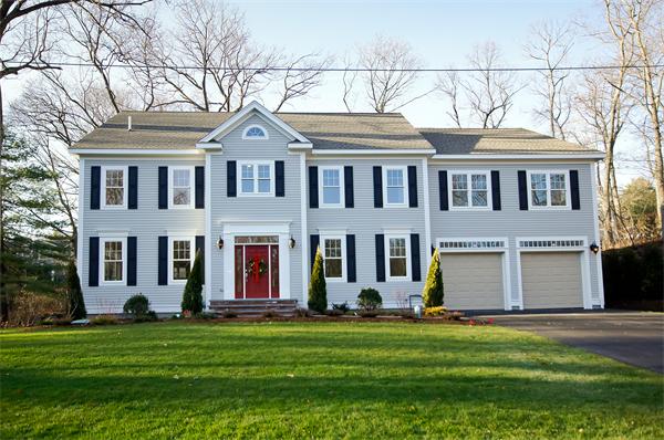 65 Munroe Road Lexington, MA 02421 - Photo 1 of 11 a front view of a house with a yard