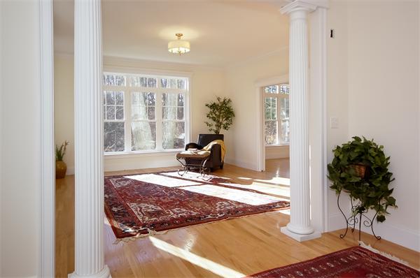 65 Munroe Road Lexington, MA 02421 - Photo 3 of 11 a living room with wooden floor and a potted plant