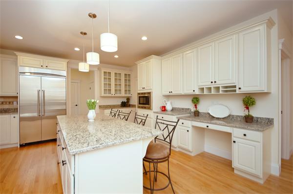 65 Munroe Road Lexington, MA 02421 - Photo 6 of 11 a kitchen with kitchen island granite countertop a sink cabinets and stainless steel appliances