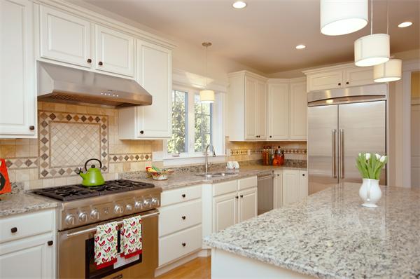 65 Munroe Road Lexington, MA 02421 - Photo 7 of 11 a kitchen with a stove a sink and a refrigerator