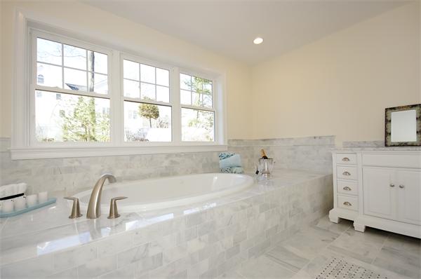 65 Munroe Road Lexington, MA 02421 - Photo 8 of 11 a bathroom with a bathtub and a sink