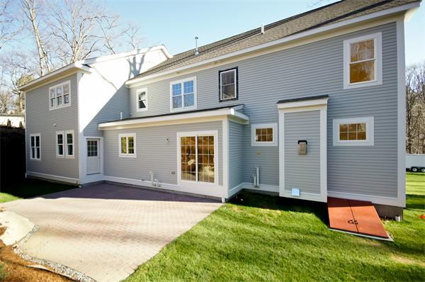 65 Munroe Road Lexington, MA 02421 - Photo 9 of 11 a front view of a house with a yard