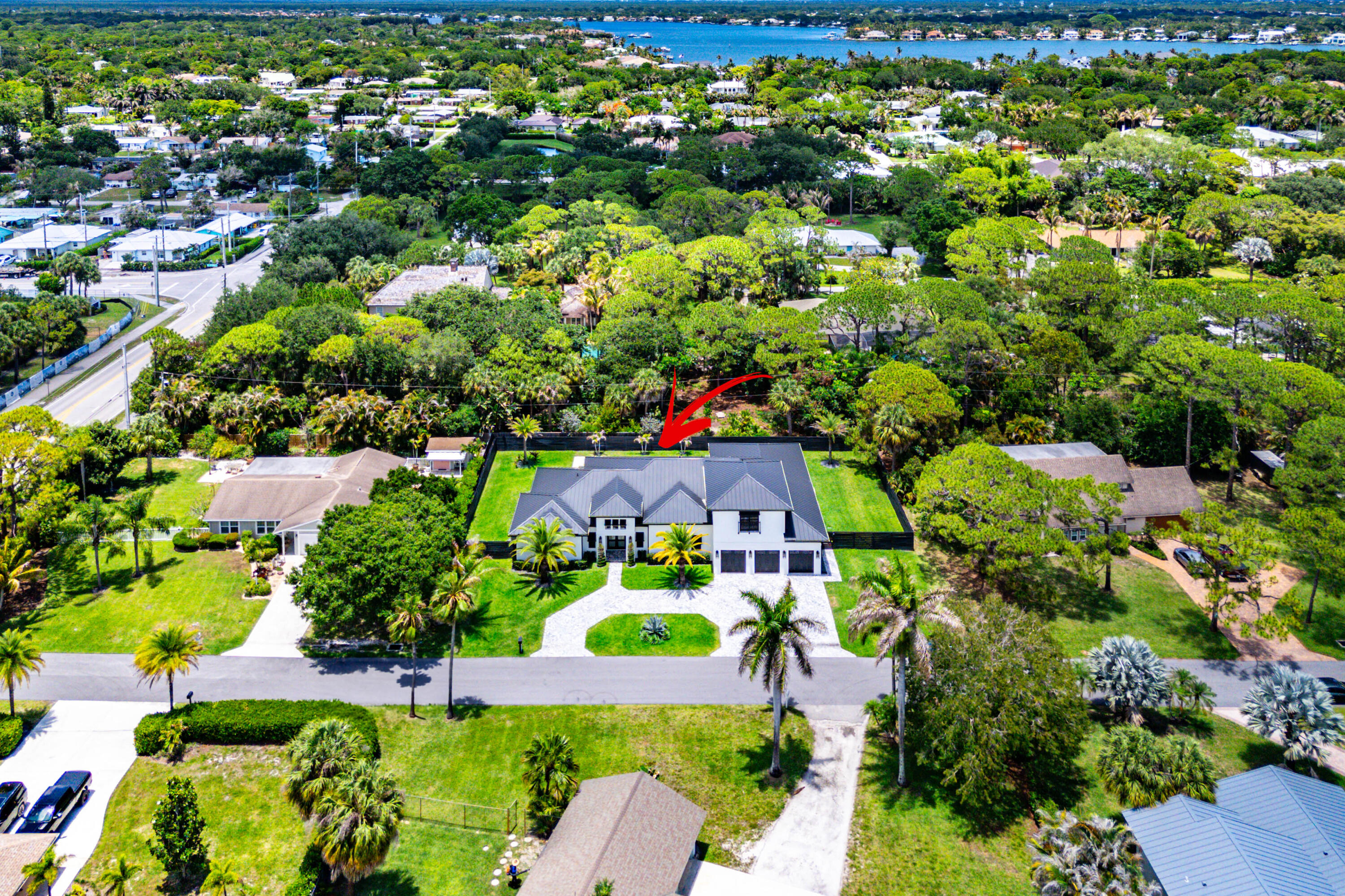5701 Old Orange Road Jupiter, FL 33458 - Photo 44 of 46 an aerial view of residential houses with outdoor space and street view