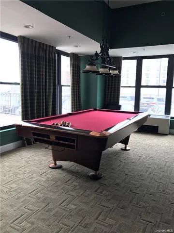 a kitchen with a sink cabinets and wooden floor