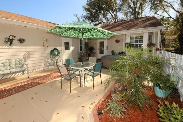 a view of a patio with a table chairs and a patio