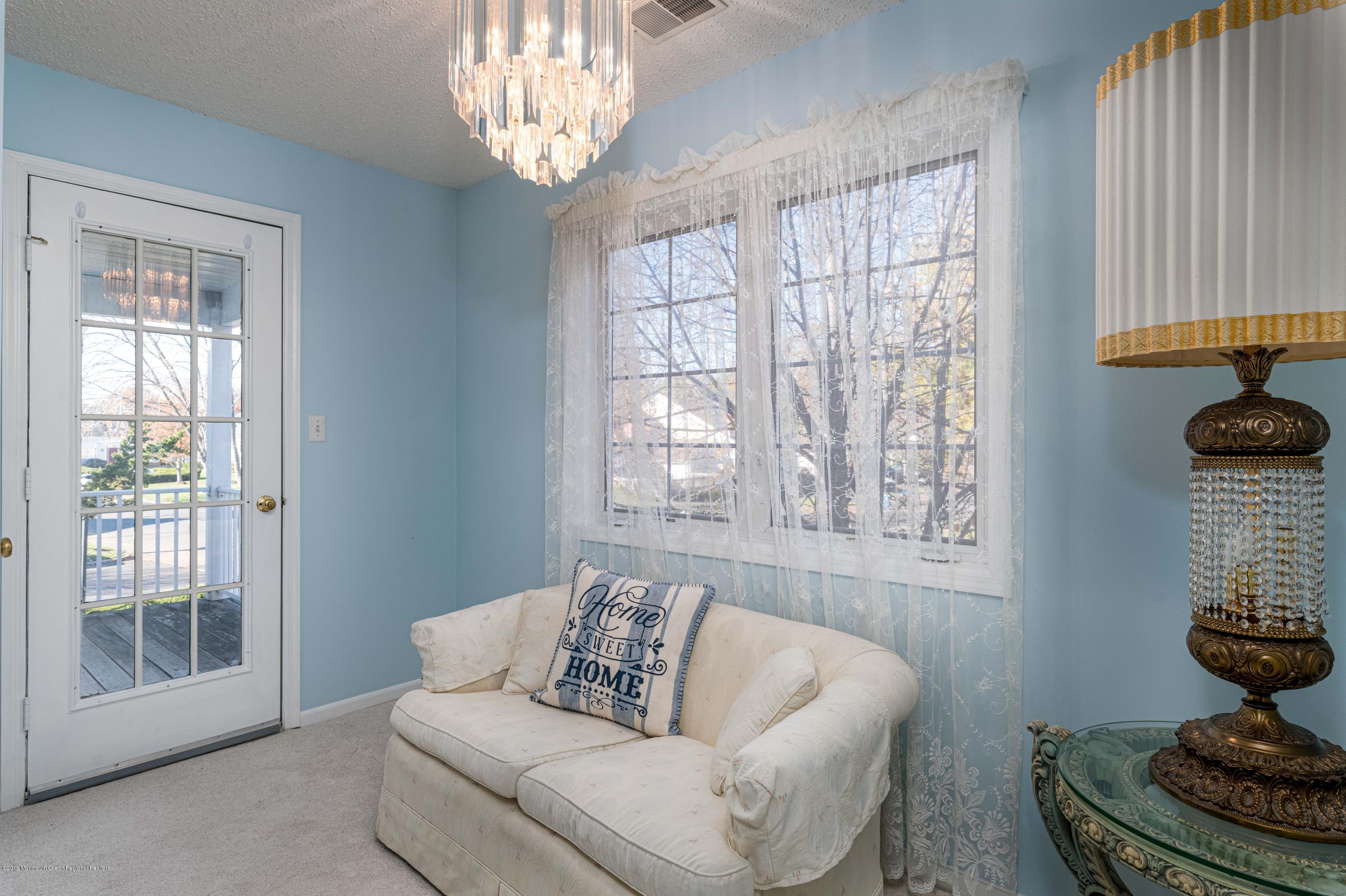72 F Winthrop Road, Unit 72F Monroe Township, NJ 08831 - Photo 5 of 28 Sitting Area w French Door to Balcony