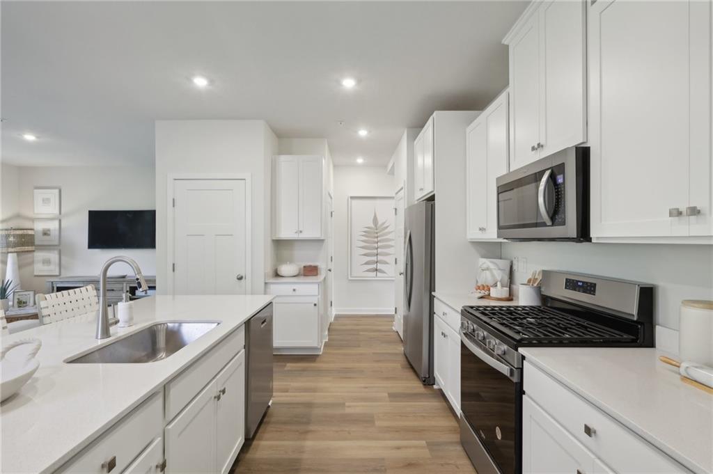 122 River Ridge Drive Coraopolis, PA 15108 - Photo 8 of 22 a kitchen with stainless steel appliances a sink stove top oven and refrigerator