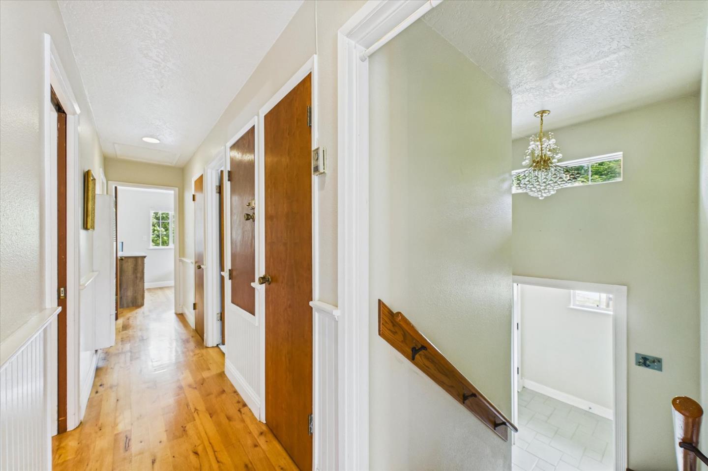 520 Redwood Road Whitethorn, CA 95589 - Photo 21 of 69 a view of a hallway with wooden floor and staircase