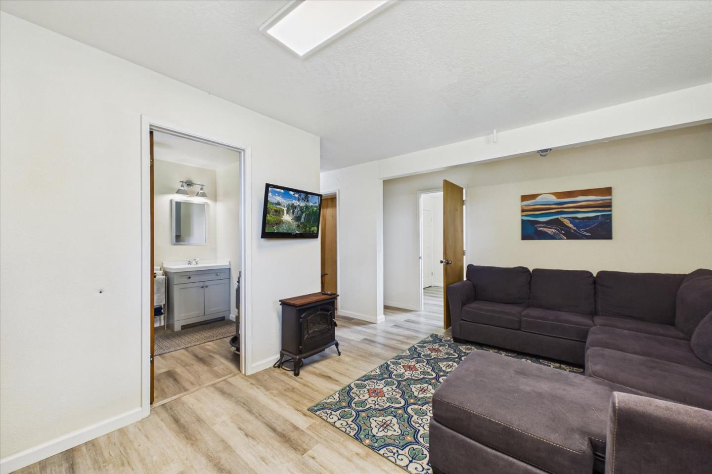 520 Redwood Road Whitethorn, CA 95589 - Photo 33 of 69 a living room with furniture and a flat screen tv