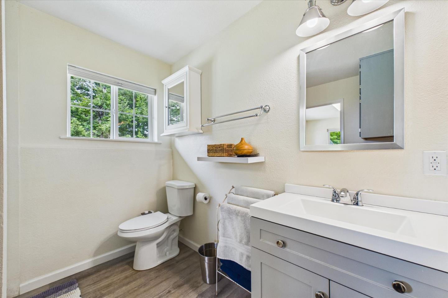 520 Redwood Road Whitethorn, CA 95589 - Photo 34 of 69 a bathroom with a toilet sink and mirror