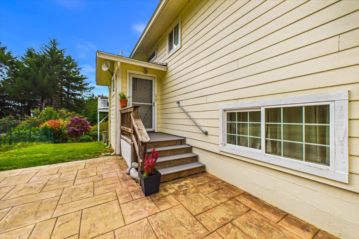 520 Redwood Road Whitethorn, CA 95589 - Photo 5 of 69 a front view of a house with a yard and seating area