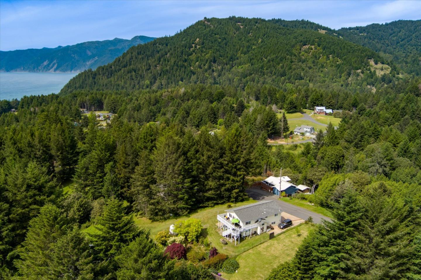 520 Redwood Road Whitethorn, CA 95589 - Photo 61 of 69 a view of a lush green hillside and houses