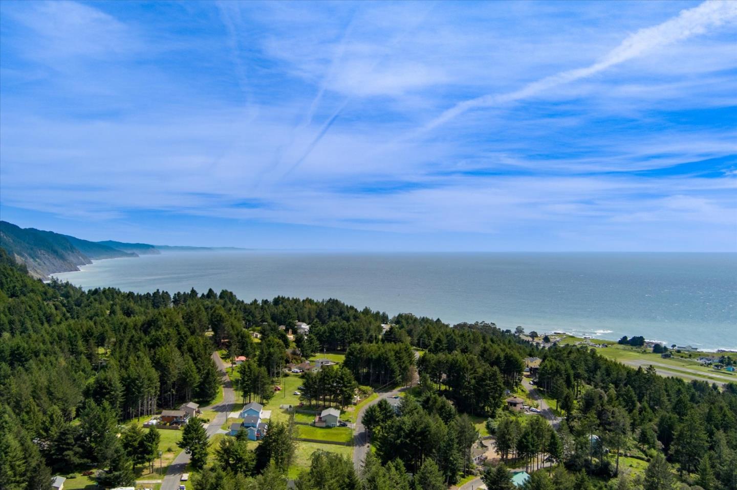 520 Redwood Road Whitethorn, CA 95589 - Photo 67 of 69 a view of a lake with houses in back