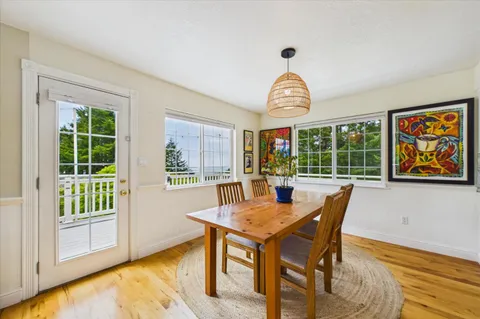 a kitchen with stainless steel appliances granite countertop a granite counter tops and a view of living room