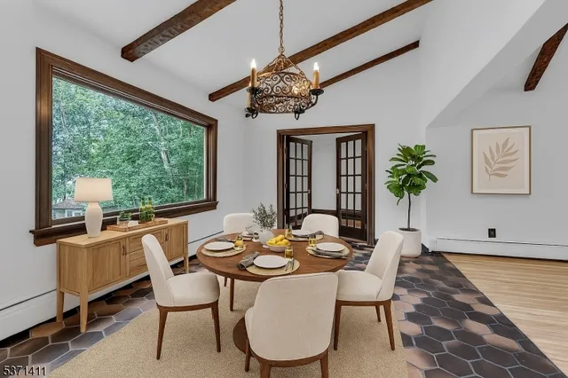 a view of a dining room with furniture window and outside view