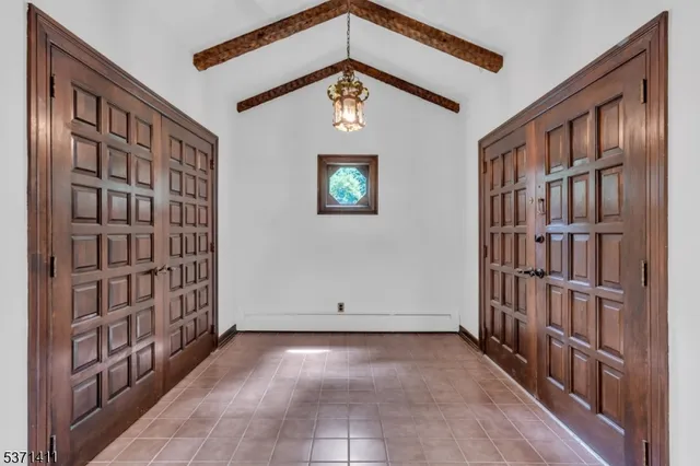 a view of an entryway with a book shelf