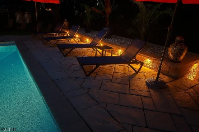 a backyard of a house with table and chairs