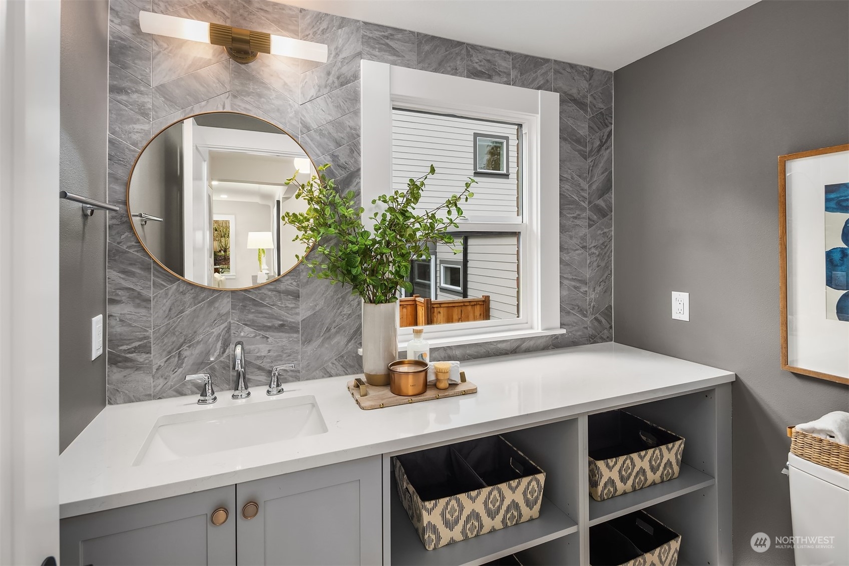 8021 Wallingford Avenue North Seattle, WA 98103 - Photo 13 of 39 a bathroom with a sink a mirror and vanity