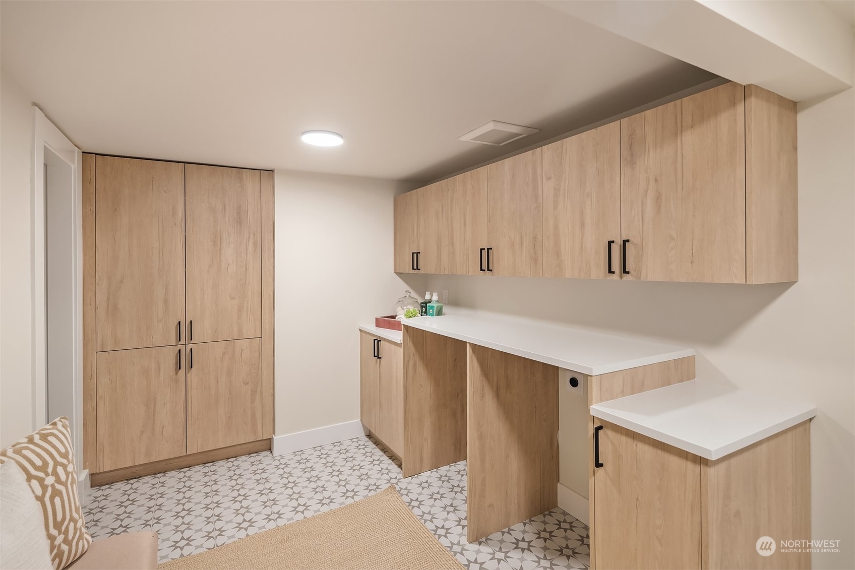8021 Wallingford Avenue North Seattle, WA 98103 - Photo 22 of 39 a view of cabinets with wooden floor