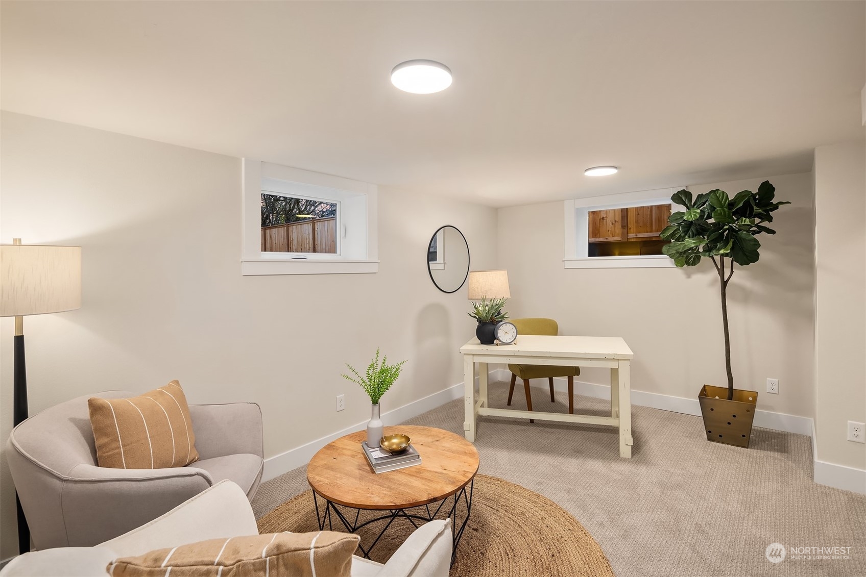 8021 Wallingford Avenue North Seattle, WA 98103 - Photo 24 of 39 a living room with furniture and a potted plant