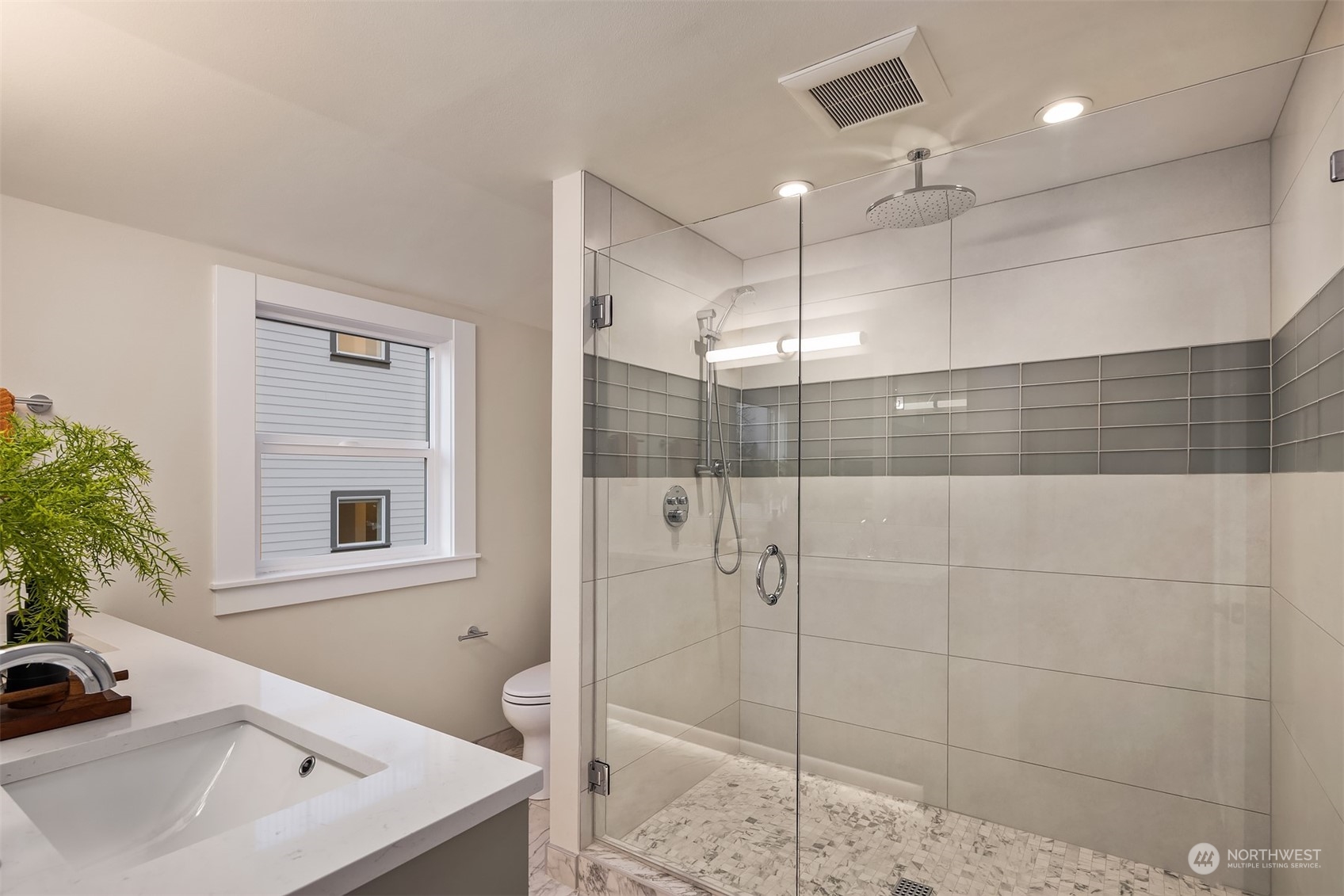 8021 Wallingford Avenue North Seattle, WA 98103 - Photo 33 of 39 a bathroom with a sink and a shower