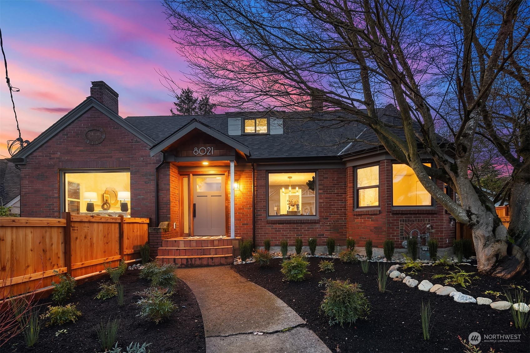 8021 Wallingford Avenue North Seattle, WA 98103 - Photo 36 of 39 a front view of a house with a yard