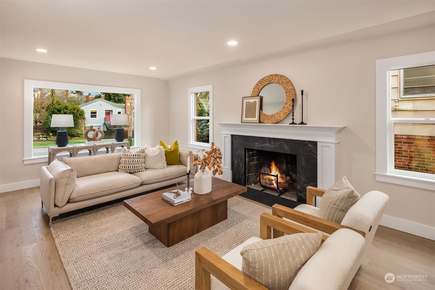 8021 Wallingford Avenue North Seattle, WA 98103 - Photo 5 of 39 a living room with furniture and a fireplace