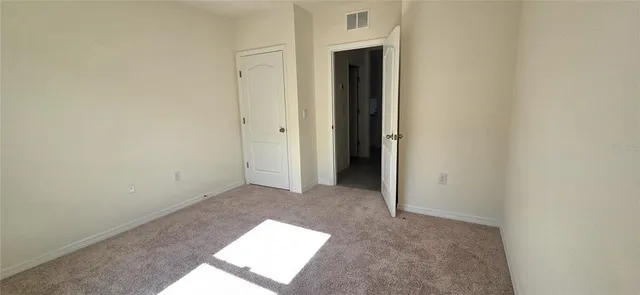 a view of hallway with washer and dryer