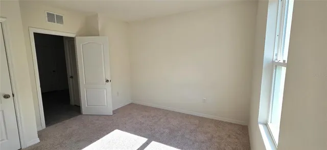 a view of hallway with closet