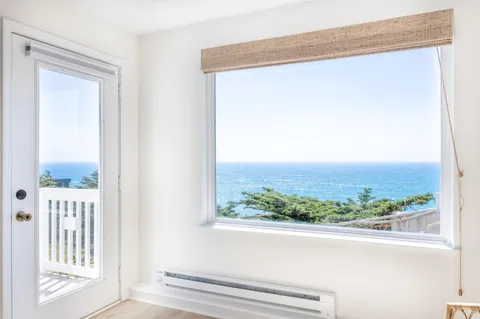 a view of a glass door and a window