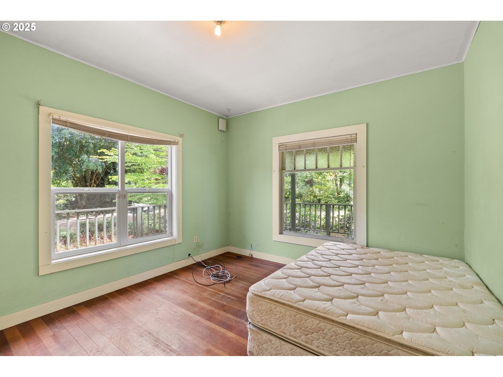 83015 Peninsula Road Fall Creek, OR 97438 - Photo 16 of 40 a bedroom with a bed and a window