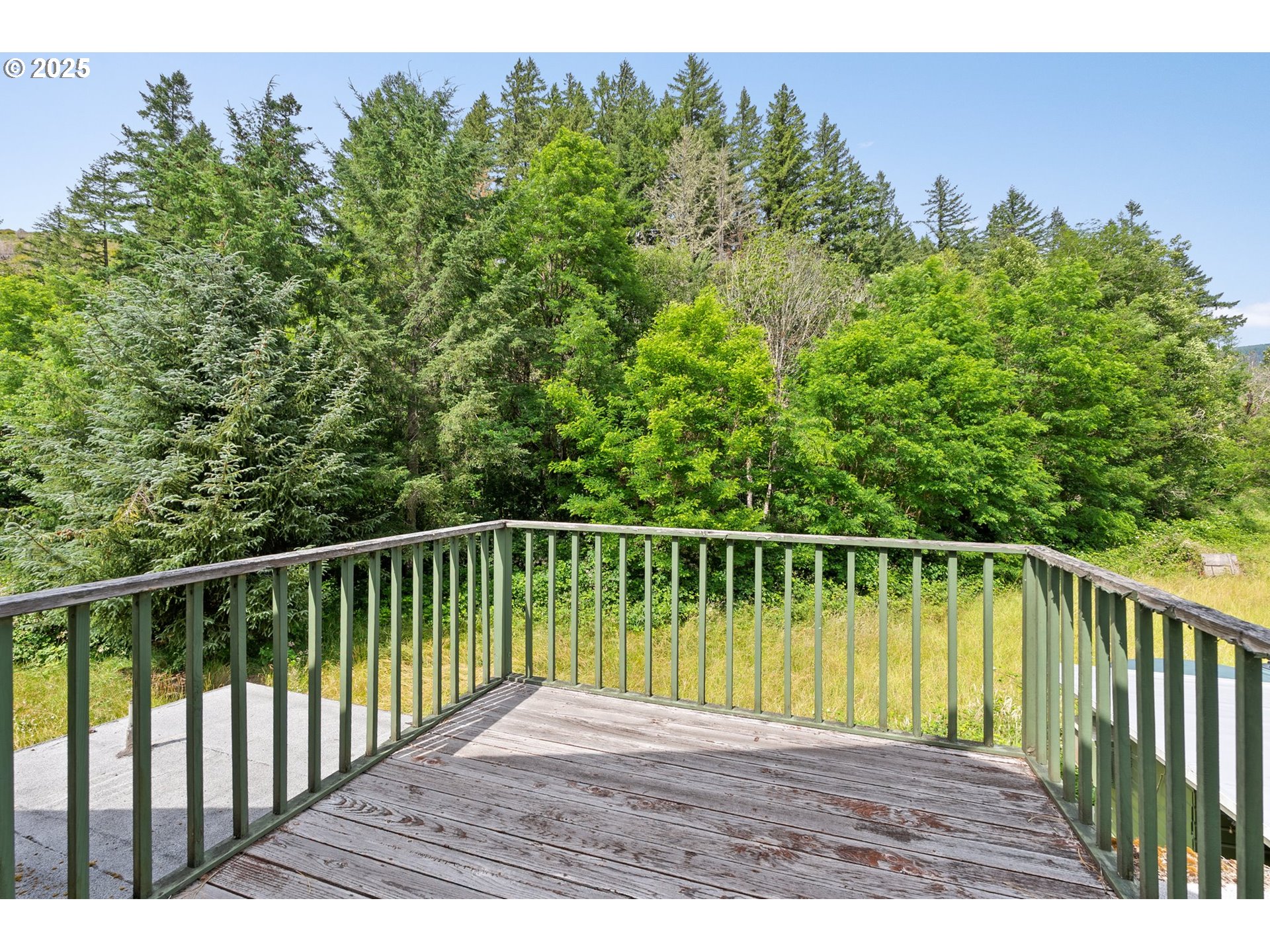 83015 Peninsula Road Fall Creek, OR 97438 - Photo 19 of 40 a view of balcony with wooden floor and fence