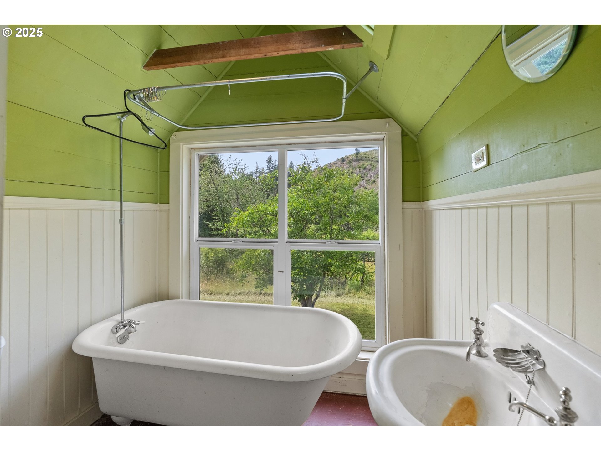 83015 Peninsula Road Fall Creek, OR 97438 - Photo 21 of 40 a white bath tub sitting next to a window