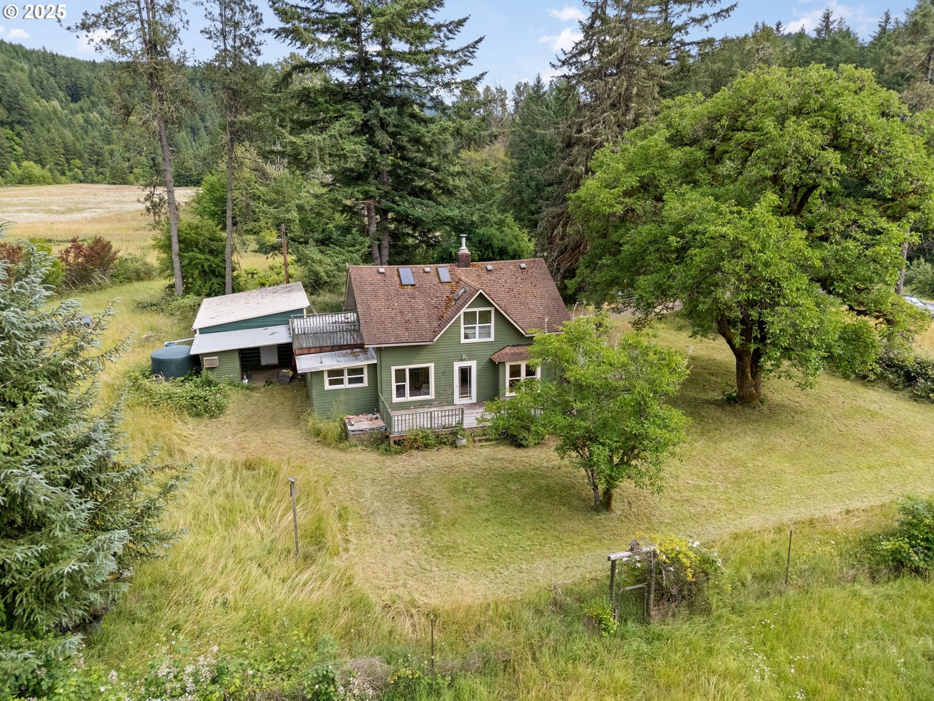 83015 Peninsula Road Fall Creek, OR 97438 - Photo 27 of 40 a aerial view of a house with swimming pool next to a yard