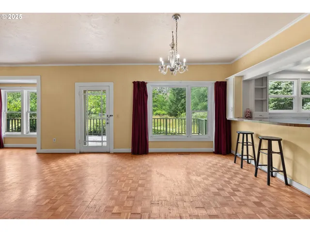 a view of livingroom with furniture wooden floor and windows