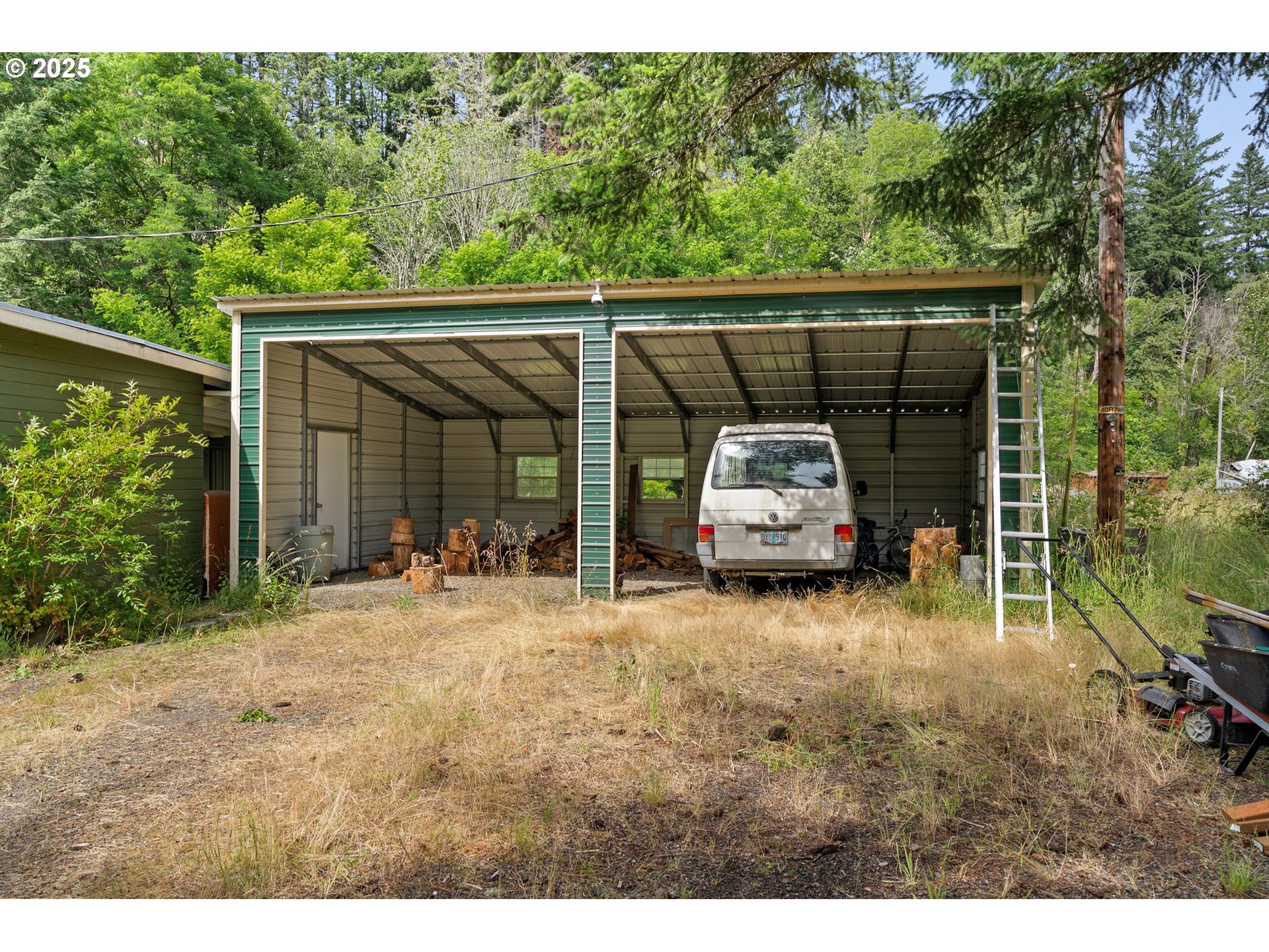 83015 Peninsula Road Fall Creek, OR 97438 - Photo 35 of 40 a car parked in front of house