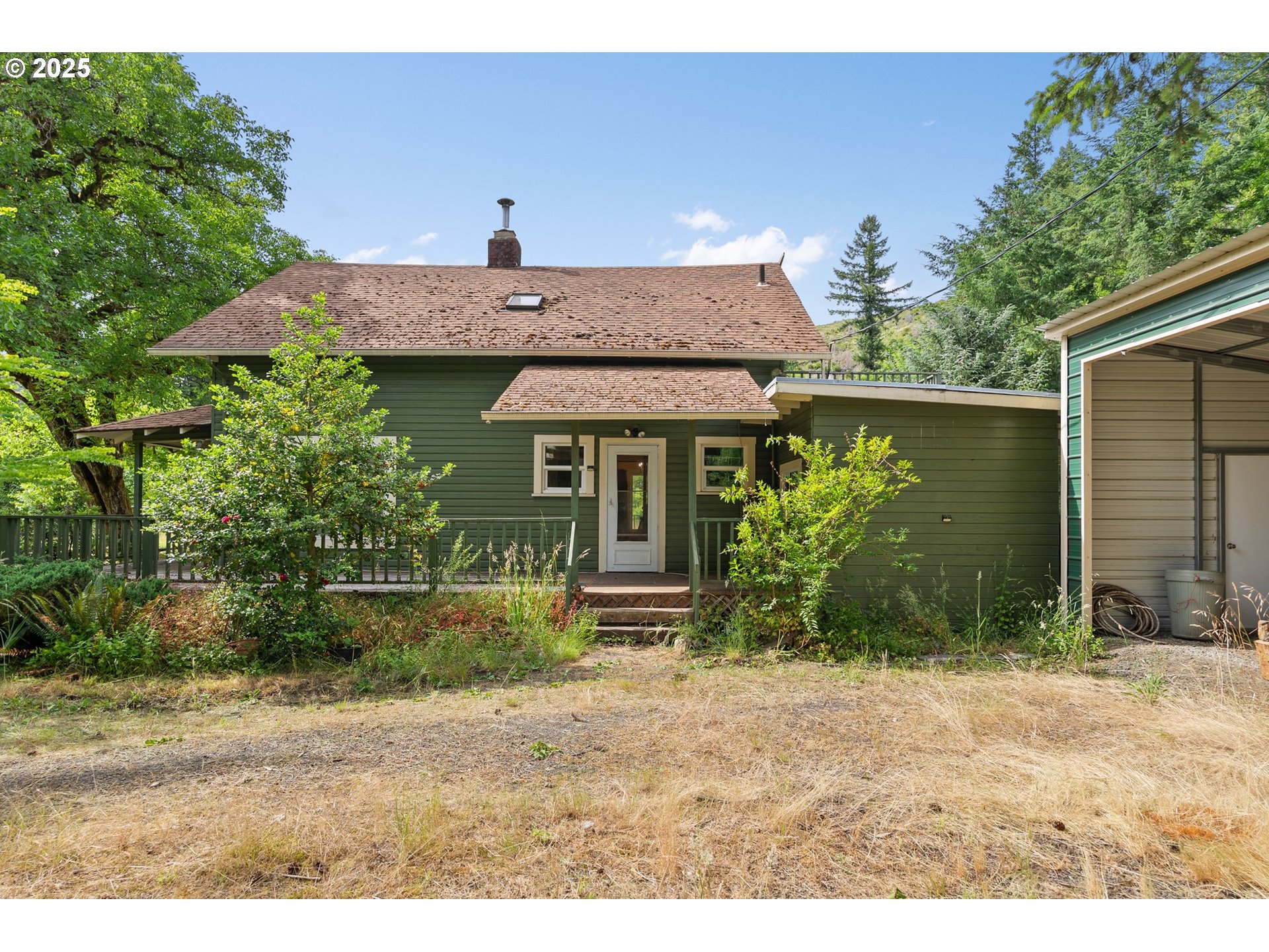 83015 Peninsula Road Fall Creek, OR 97438 - Photo 36 of 40 a front view of a house with garden