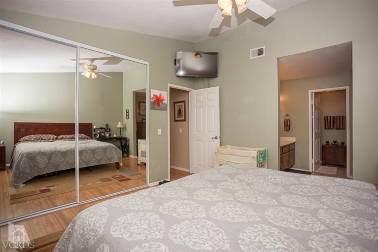 13648 Laurelhurst Road Moorpark, CA 93021 - Photo 15 of 32 a bedroom with a bed and a walk in closet