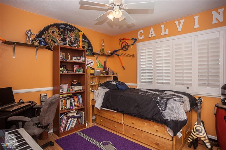 13648 Laurelhurst Road Moorpark, CA 93021 - Photo 19 of 32 a bedroom with furniture and a book shelf