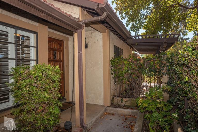13648 Laurelhurst Road Moorpark, CA 93021 - Photo 3 of 32 a view of house with trees in front of it