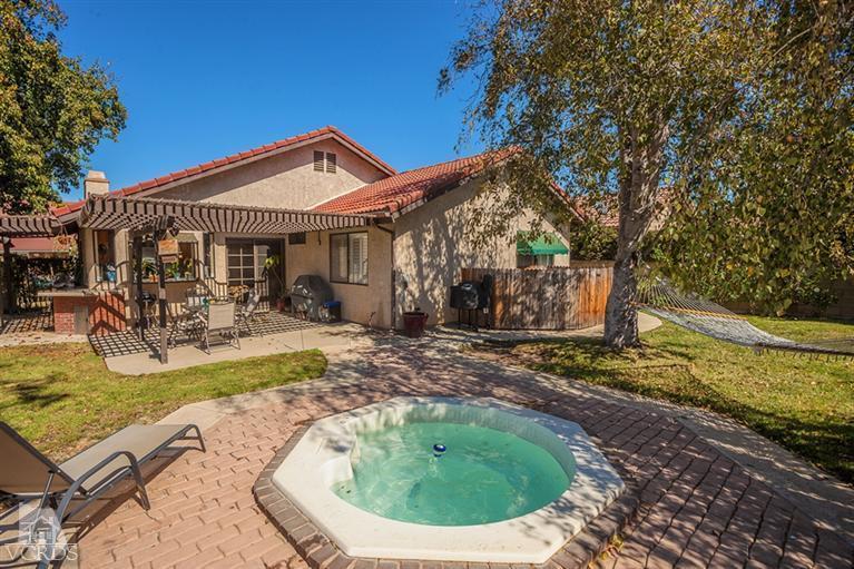 13648 Laurelhurst Road Moorpark, CA 93021 - Photo 21 of 32 a view of a house with swimming pool and sitting area