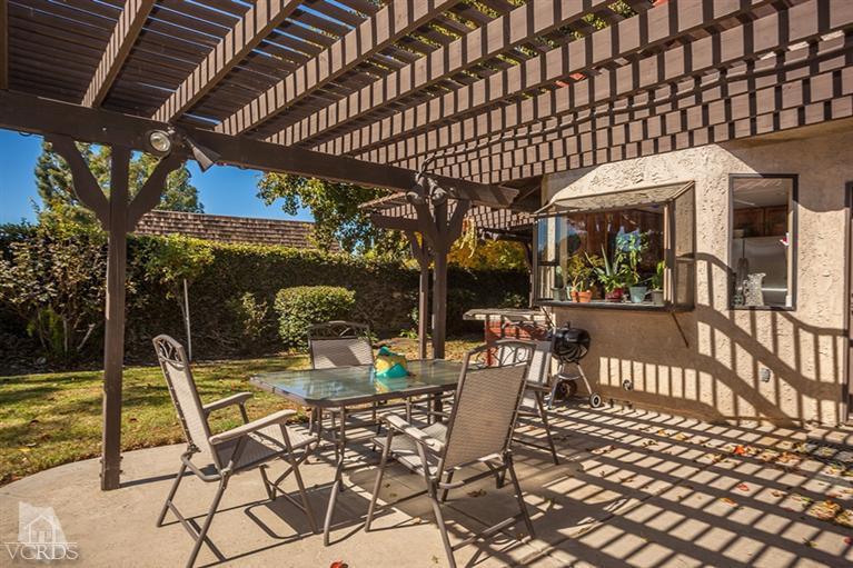 13648 Laurelhurst Road Moorpark, CA 93021 - Photo 27 of 32 a view of a patio with a table and chairs