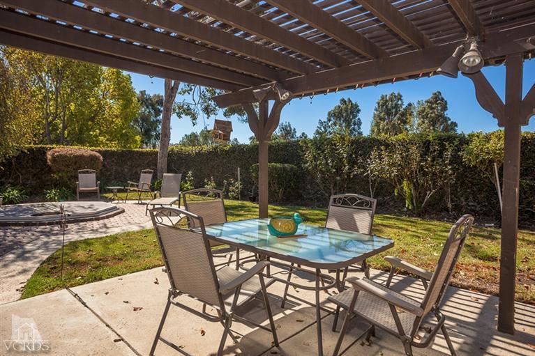 13648 Laurelhurst Road Moorpark, CA 93021 - Photo 28 of 32 a view of a patio with a table chairs and a backyard